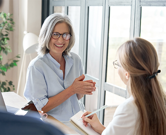 Senior woman smiling in an office